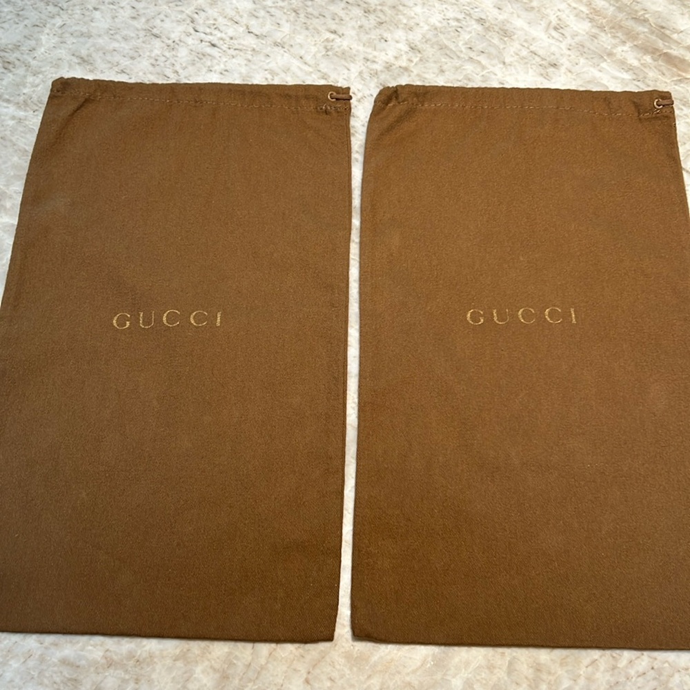 2-Gucci dust covers.